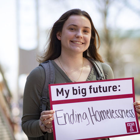 Grace Ratkey holding a sign that says My big future: Ending homelessness