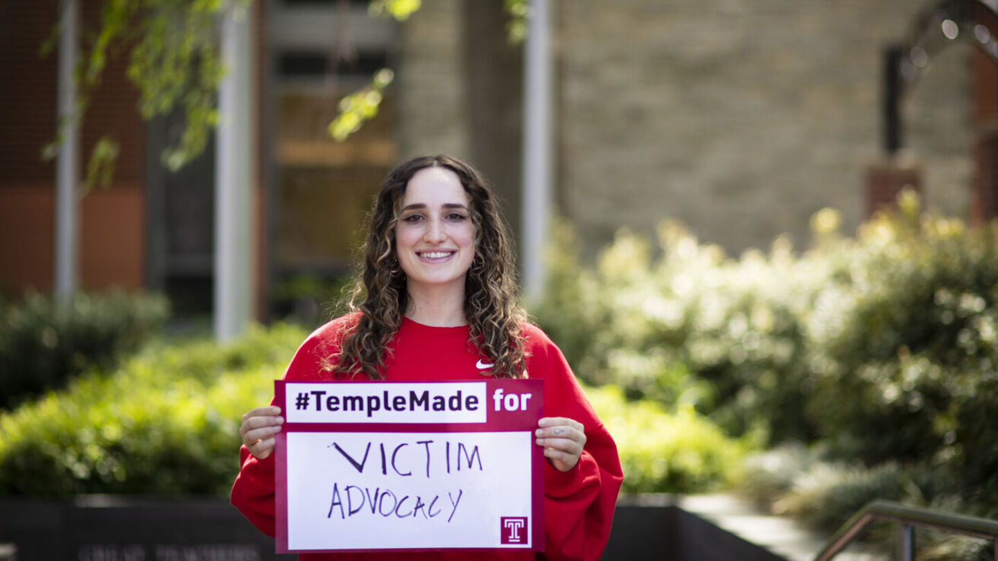 Ray Epstein, Temple Student Government president and Truman Scholar, will work for a judge in D.C. this summer and as a client services intern in Denver this fall. Ray Epstein holding a Temple Made for sign outside of Main Campus