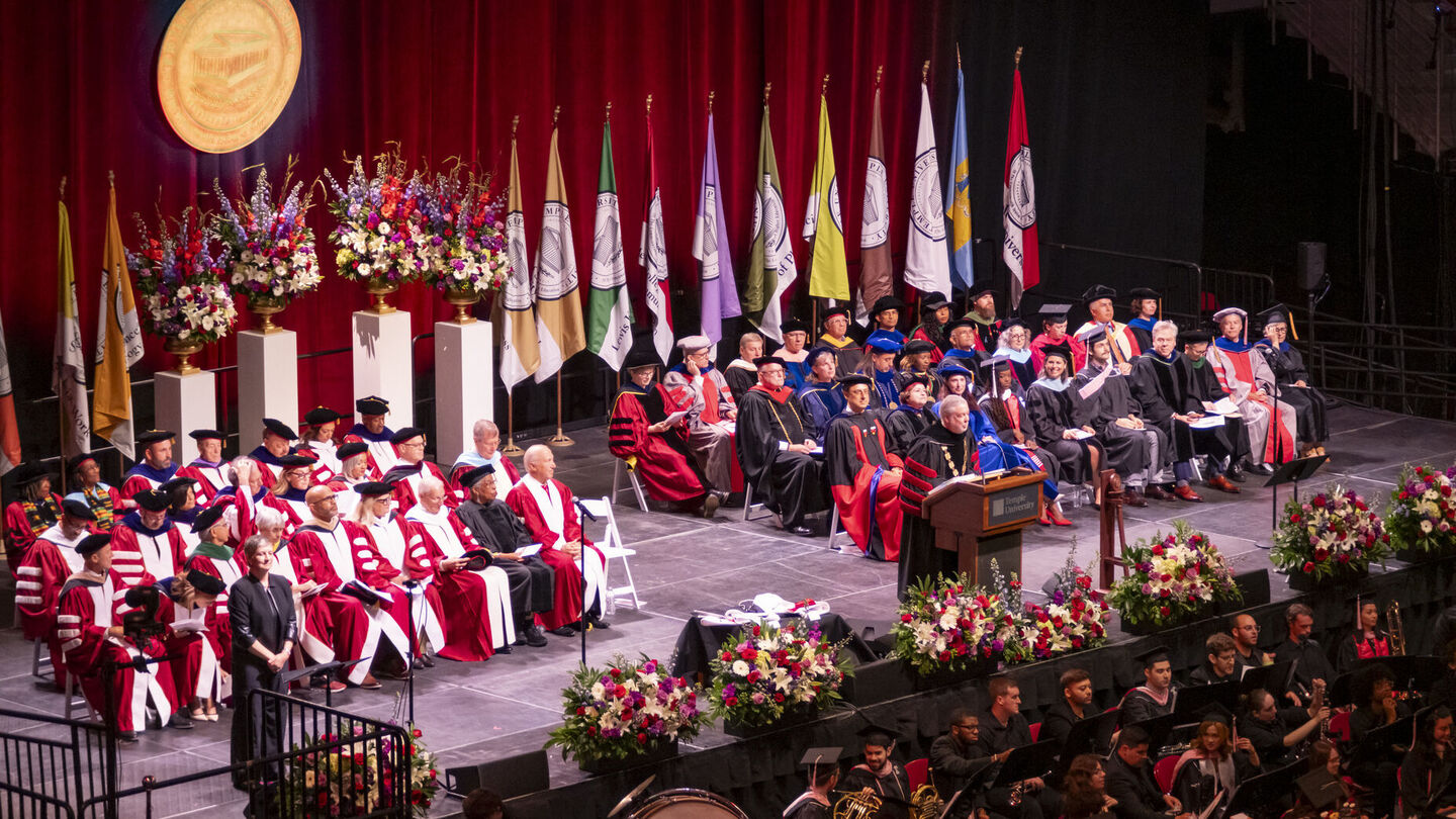 President Fry speaking at podium during Commencement
